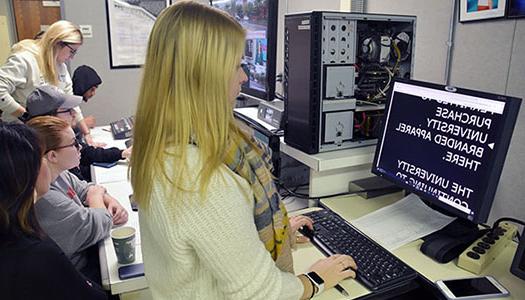 Students work in the control room at the Koop Lab